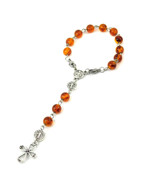 Rosary on hand, Amber